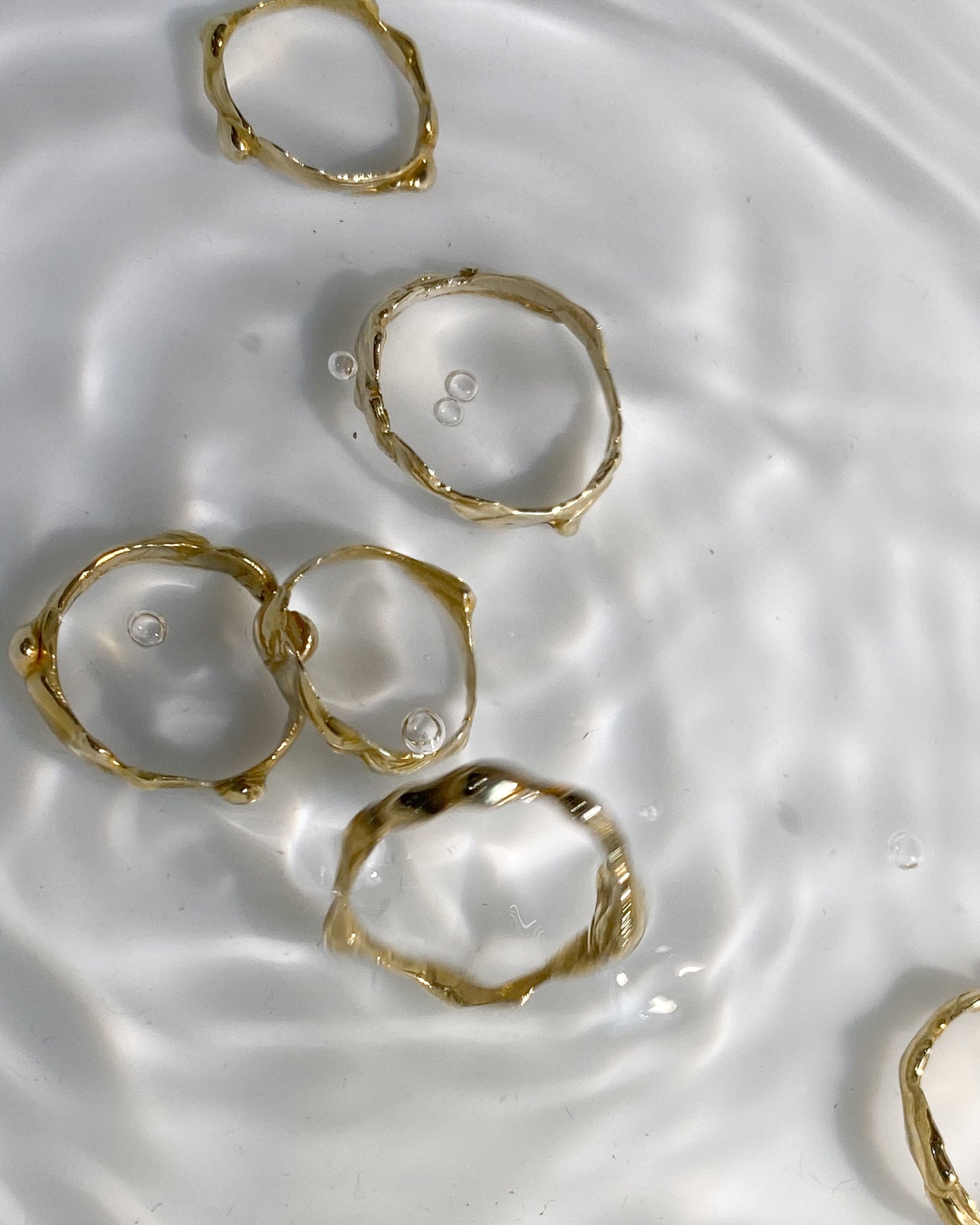 6 molten rings in water